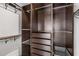 A bedroom closet with custom shelves, drawers, and multiple hanging rods for ample storage at 1225 Chelsea Nw Cir, Atlanta, GA 30318