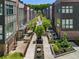 Enjoy beautifully landscaped common areas featuring modern townhomes, water features, and mature trees at 1225 Chelsea Nw Cir, Atlanta, GA 30318