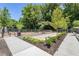 Community dog park with separate play areas and seating, surrounded by lush landscaping and mature trees at 1225 Chelsea Nw Cir, Atlanta, GA 30318