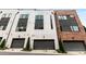 Beautiful modern townhomes boasting a mix of white stucco and brick exteriors with clean, contemporary lines at 1225 Chelsea Nw Cir, Atlanta, GA 30318