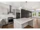 A modern kitchen features stainless steel appliances, stone countertops and modern lighting at 1225 Chelsea Nw Cir, Atlanta, GA 30318
