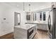 Modern kitchen features a stone countertop island and stainless steel appliances at 1225 Chelsea Nw Cir, Atlanta, GA 30318