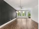 Open living room with hardwood floors, modern lighting and large windows providing ample light at 1225 Chelsea Nw Cir, Atlanta, GA 30318