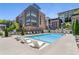 Serene community pool with modern lounge chairs and landscaping, providing a tranquil oasis for residents at 1225 Chelsea Nw Cir, Atlanta, GA 30318
