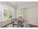 Inviting dining area with large windows and comfortable seating, perfect for gatherings at 1858 Perry Nw Blvd, Atlanta, GA 30318