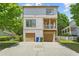 Two-story home with a spacious two car garage and an inviting second floor balcony at 1858 Perry Nw Blvd, Atlanta, GA 30318