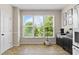 Bright kitchen nook with large windows overlooking lush greenery, great for enjoying the outdoors at 1858 Perry Nw Blvd, Atlanta, GA 30318