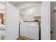 Convenient laundry room with washer, dryer, and storage cabinets at 1858 Perry Nw Blvd, Atlanta, GA 30318