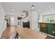 Open-concept living area with hardwood floors and seamless flow to the kitchen at 1858 Perry Nw Blvd, Atlanta, GA 30318