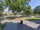 View of a grassy park with walking paths and playground equipment under a canopy of trees at 1858 Perry Nw Blvd, Atlanta, GA 30318