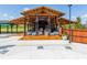 Exterior shot of a covered pavilion with seating and an outdoor kitchen area by the community pool at 1858 Perry Nw Blvd, Atlanta, GA 30318