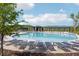 Large community pool with lounge chairs surrounded by lush greenery at 1858 Perry Nw Blvd, Atlanta, GA 30318
