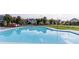 Community pool with green grass and trees in background at 1858 Perry Nw Blvd, Atlanta, GA 30318