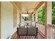 Relaxing covered porch featuring stylish seating and a ceiling fan at 1858 Perry Nw Blvd, Atlanta, GA 30318