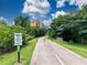 Road leading to building entrance surrounded by lush greenery, offering a serene approach at 1858 Perry Nw Blvd, Atlanta, GA 30318