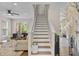 Inviting staircase with wood and white accents, leading to the upper level of the home at 1858 Perry Nw Blvd, Atlanta, GA 30318