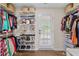 Spacious walk-in closet with racks and shelves for clothes, shoes, and accessories at 1858 Perry Nw Blvd, Atlanta, GA 30318