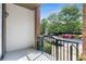 Private balcony overlooking a tree-lined street, providing a tranquil outdoor space at 901 Abernathy Ne Rd # 2050, Sandy Springs, GA 30328