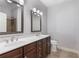 Bathroom featuring double sink vanity with granite countertop and modern fixtures at 901 Abernathy Ne Rd # 2050, Sandy Springs, GA 30328