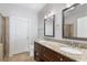 Bathroom features a granite countertop vanity with double sinks, neutral walls, and modern fixtures at 901 Abernathy Ne Rd # 2050, Sandy Springs, GA 30328