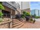 Beautiful entryway with manicured landscaping and elegant signage at 901 Abernathy Ne Rd # 2050, Sandy Springs, GA 30328