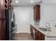Spacious kitchen with stainless steel appliances, granite counters, dark cabinets, and hardwood floors at 901 Abernathy Ne Rd # 2050, Sandy Springs, GA 30328