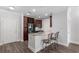 Modern kitchen featuring an island with seating, stainless steel appliances, and granite countertops at 901 Abernathy Ne Rd # 2050, Sandy Springs, GA 30328