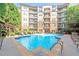 Inviting community pool surrounded by lounge chairs and lush landscaping, perfect for relaxation at 901 Abernathy Ne Rd # 2050, Sandy Springs, GA 30328