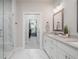 Bathroom with double sinks, marble floors, and a seamless glass shower at 1815 La Dawn Nw Ln, Atlanta, GA 30318