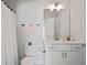 Clean bathroom with white cabinets, a large mirror, and pink hand towels at 1815 La Dawn Nw Ln, Atlanta, GA 30318