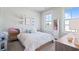 Bright bedroom featuring a light pink and floral patterned bedspread and white trim at 1815 La Dawn Nw Ln, Atlanta, GA 30318