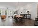 Open concept dining room with modern chandelier and an eat-in kitchen view at 1815 La Dawn Nw Ln, Atlanta, GA 30318