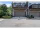 Modern townhome featuring a private garage, covered deck, and contemporary design for convenient urban living at 1815 La Dawn Nw Ln, Atlanta, GA 30318
