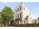 Modern three-story townhome boasts a brick exterior and a fenced yard at 1815 La Dawn Nw Ln, Atlanta, GA 30318