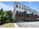 Modern townhome with multiple floors, private garages, covered decks, and contemporary design at 1815 La Dawn Nw Ln, Atlanta, GA 30318