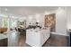 Open concept kitchen with a marble island, stainless steel appliances, and a seamless flow into the dining area at 1815 La Dawn Nw Ln, Atlanta, GA 30318