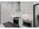 Modern kitchen features white cabinets, stainless steel appliances, and light countertops at 1815 La Dawn Nw Ln, Atlanta, GA 30318