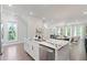 Bright kitchen with a spacious island, stainless steel appliances, and an open view to the dining and living spaces at 1815 La Dawn Nw Ln, Atlanta, GA 30318