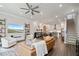 Expansive living room connects to dining and kitchen, offering an open layout and modern design at 1815 La Dawn Nw Ln, Atlanta, GA 30318