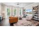 Comfortable living room features large windows, modern furniture, and stylish shelving at 1815 La Dawn Nw Ln, Atlanta, GA 30318