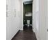 View of hallway leading to powder room with green walls and contemporary fixtures at 1815 La Dawn Nw Ln, Atlanta, GA 30318