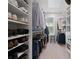Well-organized walk-in closet with custom shelving and ample storage space at 1815 La Dawn Nw Ln, Atlanta, GA 30318