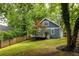 Large backyard with lush lawn and wooden fence for privacy at 230 Milton Se Ave, Atlanta, GA 30315
