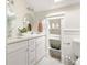 Well-lit bathroom with double vanity, stylish fixtures, and built-in shelving at 230 Milton Se Ave, Atlanta, GA 30315