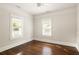 Spacious bedroom with hardwood floors, large windows, and neutral paint at 230 Milton Se Ave, Atlanta, GA 30315