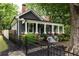 Charming home featuring a cozy front porch, beautiful landscaping, and inviting curb appeal at 230 Milton Se Ave, Atlanta, GA 30315