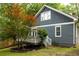 Exterior view of home with back deck, beautiful trees, and landscaped yard at 230 Milton Se Ave, Atlanta, GA 30315