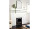 Close up of fireplace, with white brick facade and simple decor at 230 Milton Se Ave, Atlanta, GA 30315