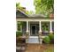 Charming front porch with columns, brick accents, stairs and beautifully landscaped flower beds at 230 Milton Se Ave, Atlanta, GA 30315