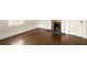 Empty living room showcasing hardwood floors, fireplace, and freshly painted walls at 230 Milton Se Ave, Atlanta, GA 30315